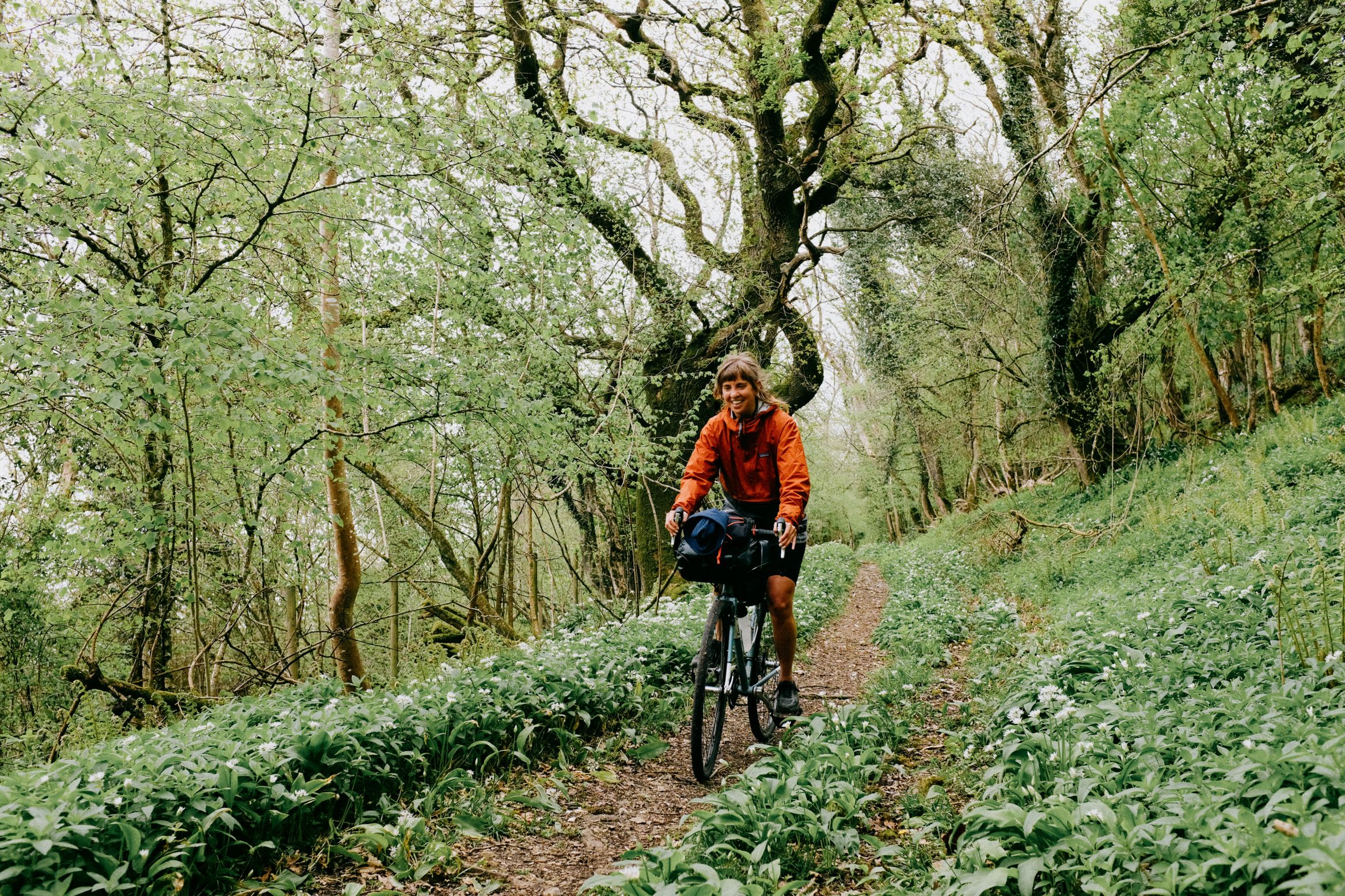 Riding a green lane in deep shade, wild garlic to both sides