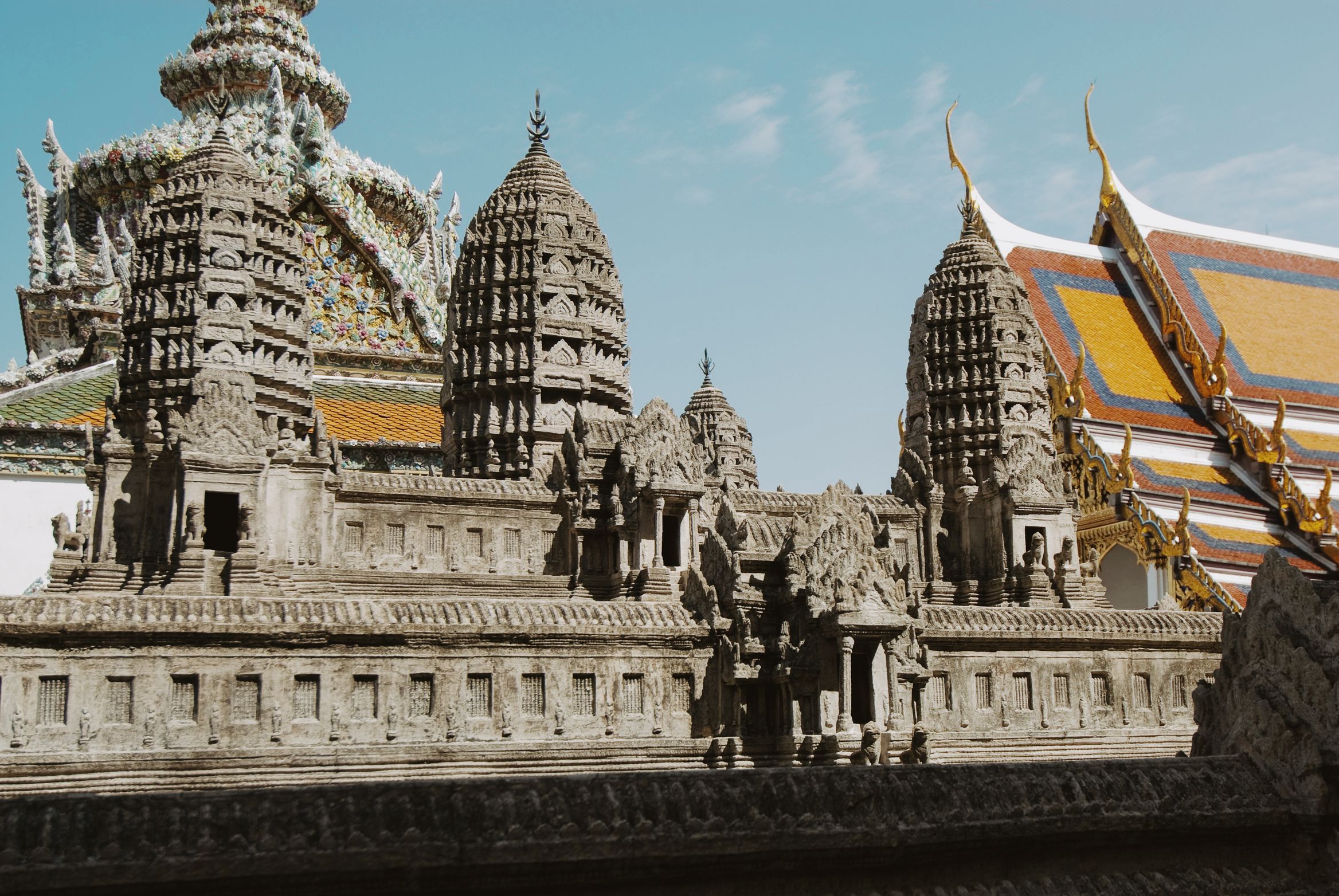 The stone scale model of Angkor Wat, temple roofs rising behind it